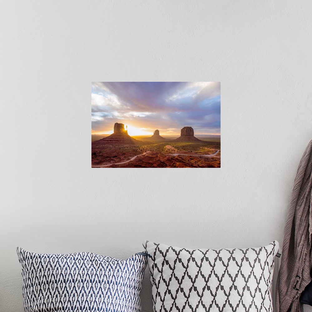 A bohemian room featuring Sunrise at the Mittens and Merrick Buttes in Monument Valley, Arizona.