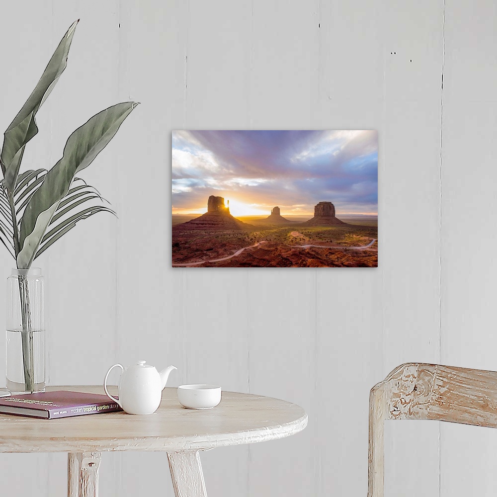 A farmhouse room featuring Sunrise at the Mittens and Merrick Buttes in Monument Valley, Arizona.