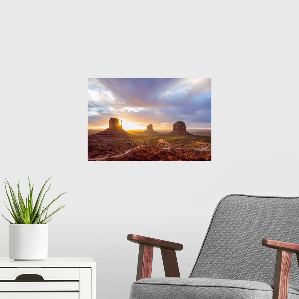 A modern room featuring Sunrise at the Mittens and Merrick Buttes in Monument Valley, Arizona.