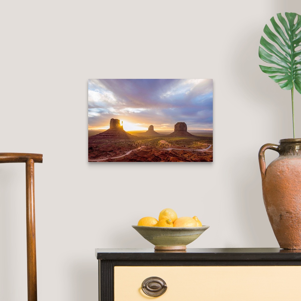 A traditional room featuring Sunrise at the Mittens and Merrick Buttes in Monument Valley, Arizona.
