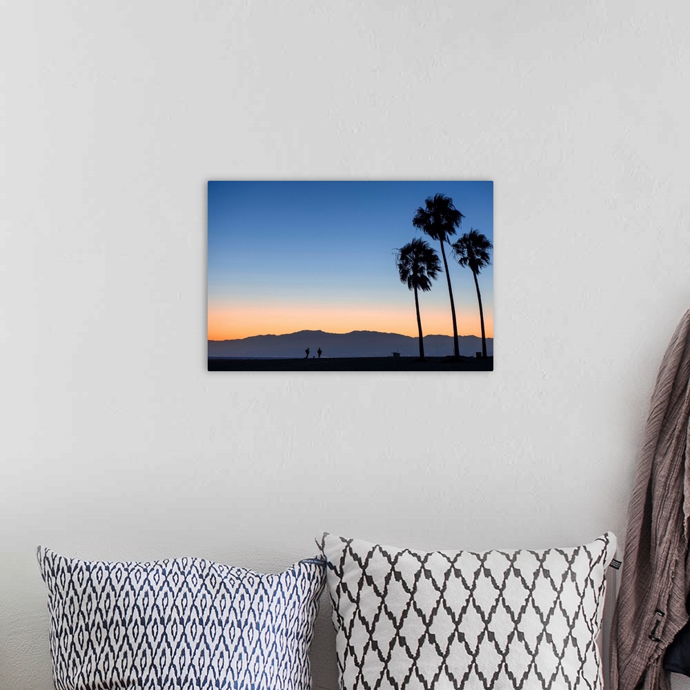 A bohemian room featuring The sun sets on Venice beach with the San Gabriel mountains in the background.