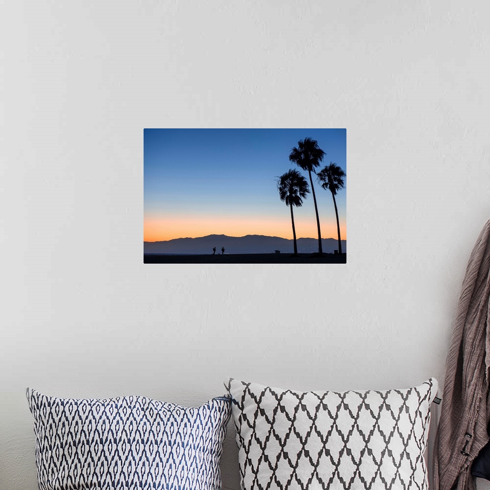 A bohemian room featuring The sun sets on Venice beach with the San Gabriel mountains in the background.