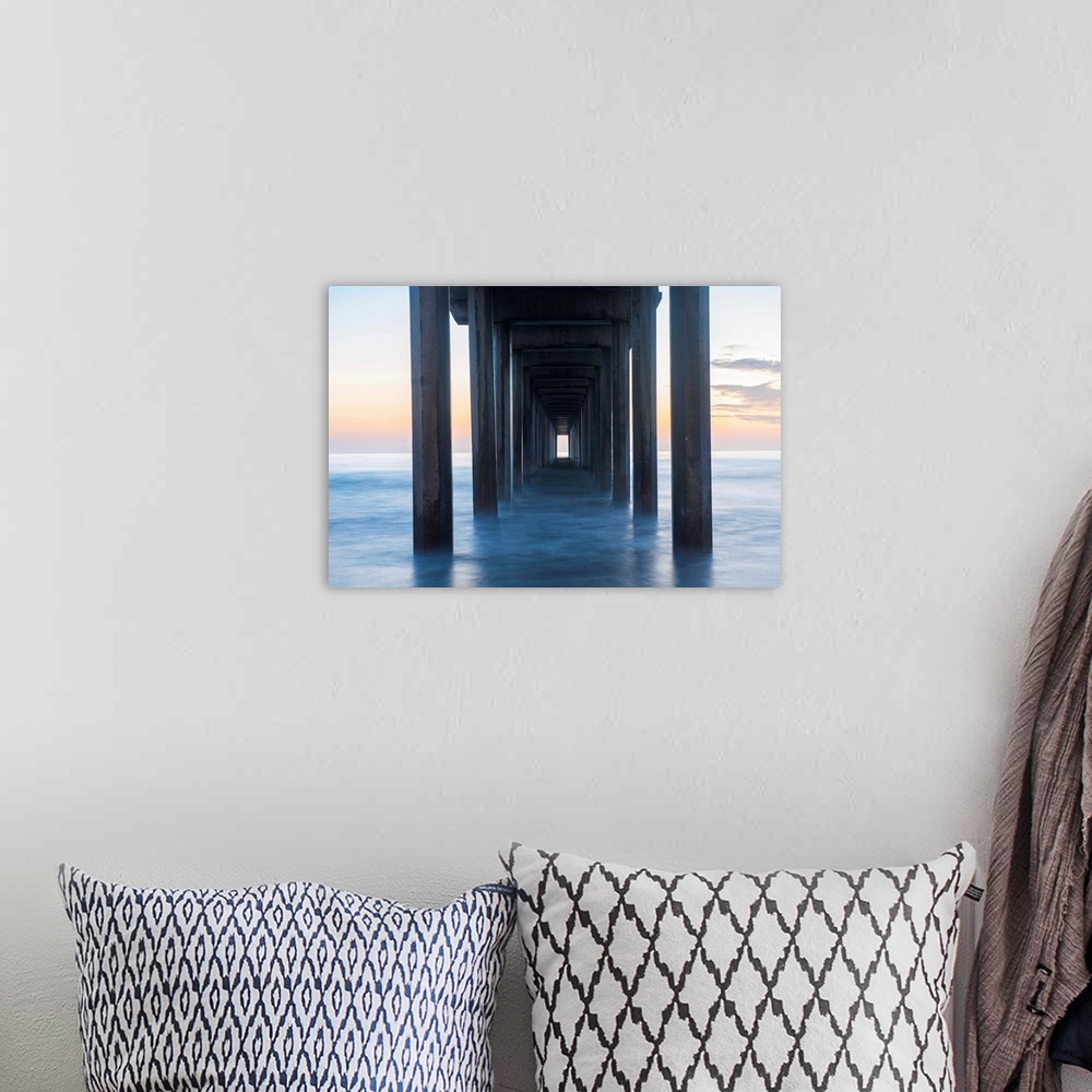 A bohemian room featuring Photograph underneath the Scripps Pier at sunset.