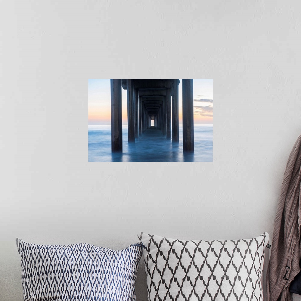 A bohemian room featuring Photograph underneath the Scripps Pier at sunset.