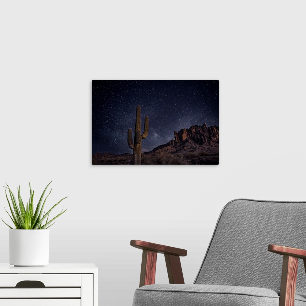 A modern room featuring View of Superstition Mountains at night, in Phoenix, Arizona.