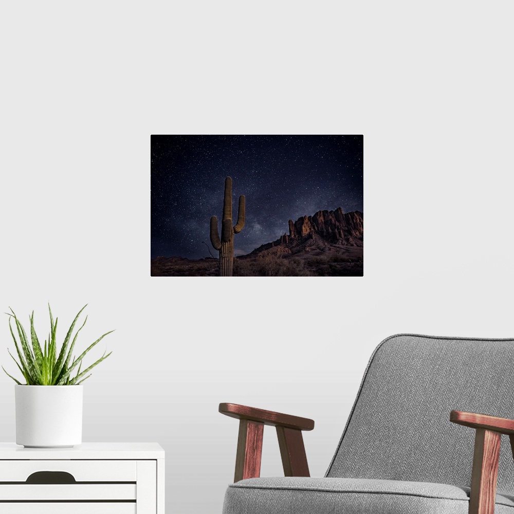 A modern room featuring View of Superstition Mountains at night, in Phoenix, Arizona.