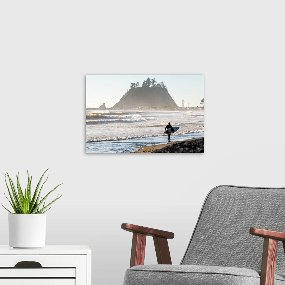 A modern room featuring Photograph of a surfer walking on the shore of La Push Beach in Washington, with misty cliffs in ...