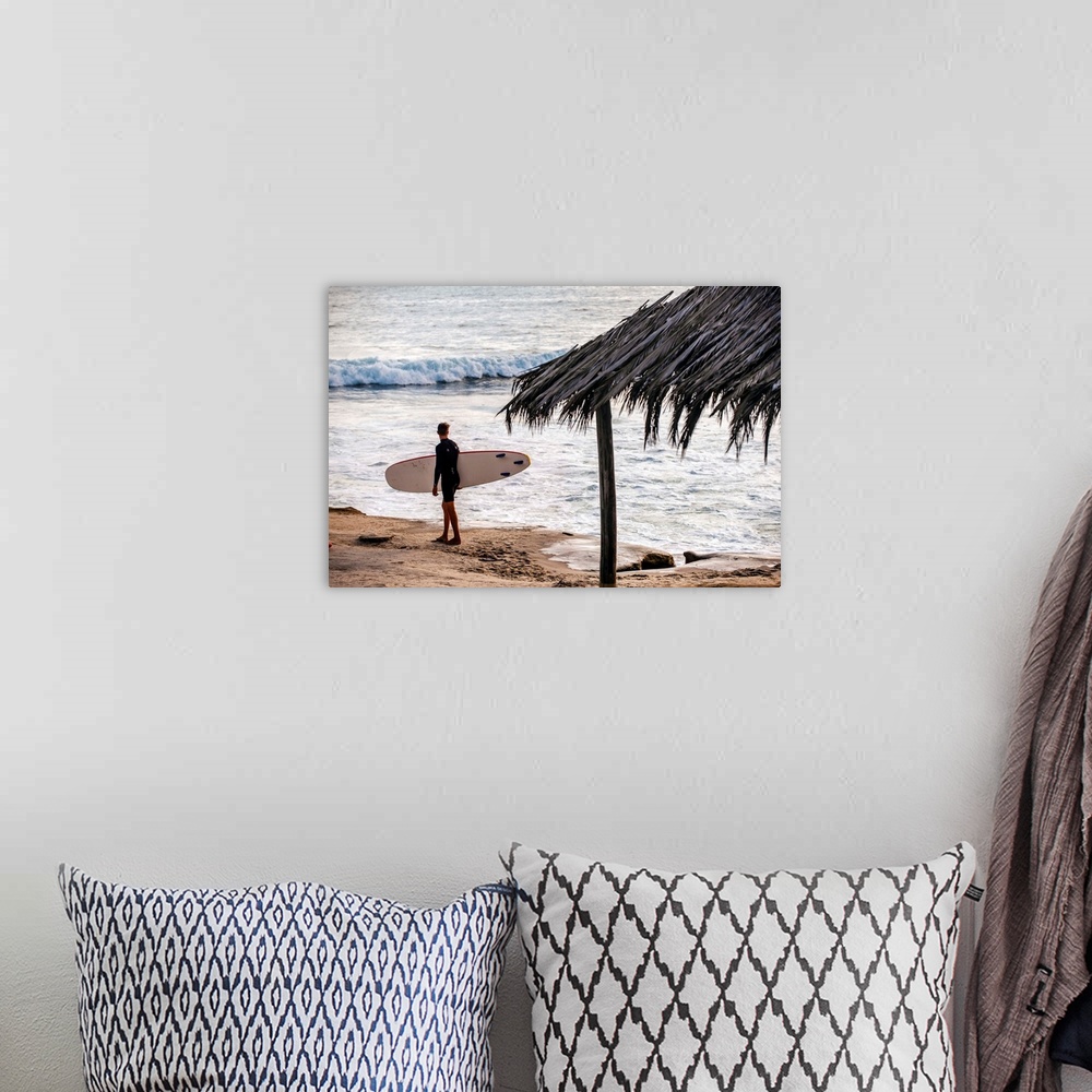 A bohemian room featuring Photograph of a surfer walking along the shore of the pacific ocean in San Diego, California, wit...
