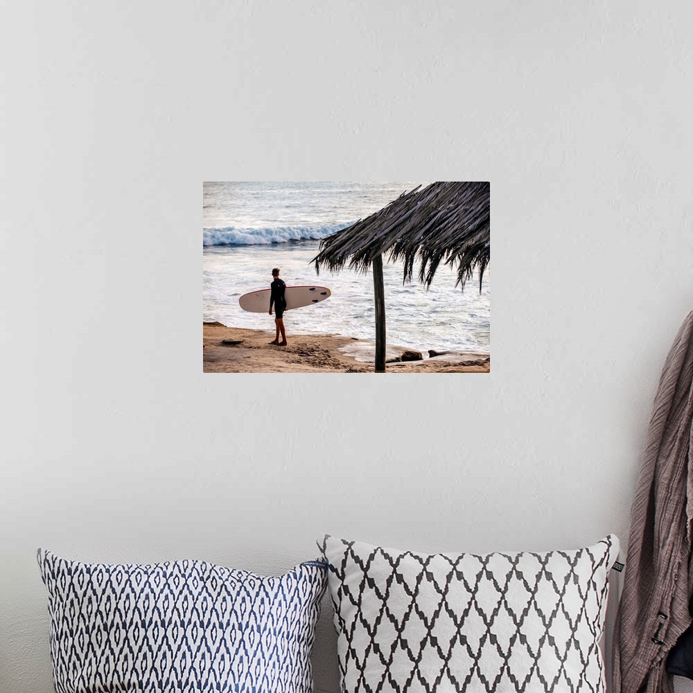 A bohemian room featuring Photograph of a surfer walking along the shore of the pacific ocean in San Diego, California, wit...