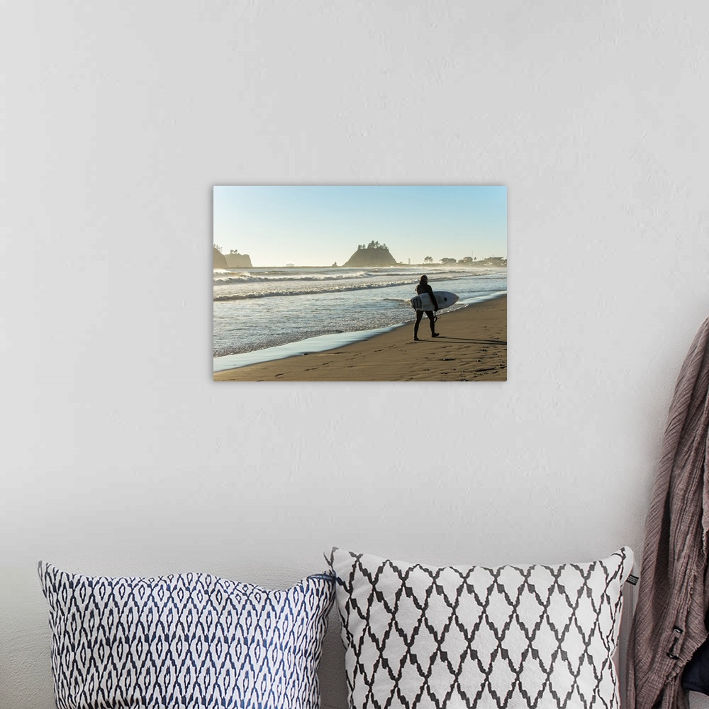 A bohemian room featuring Photograph of a surfer walking along the shore at La Push Beach in Washington.