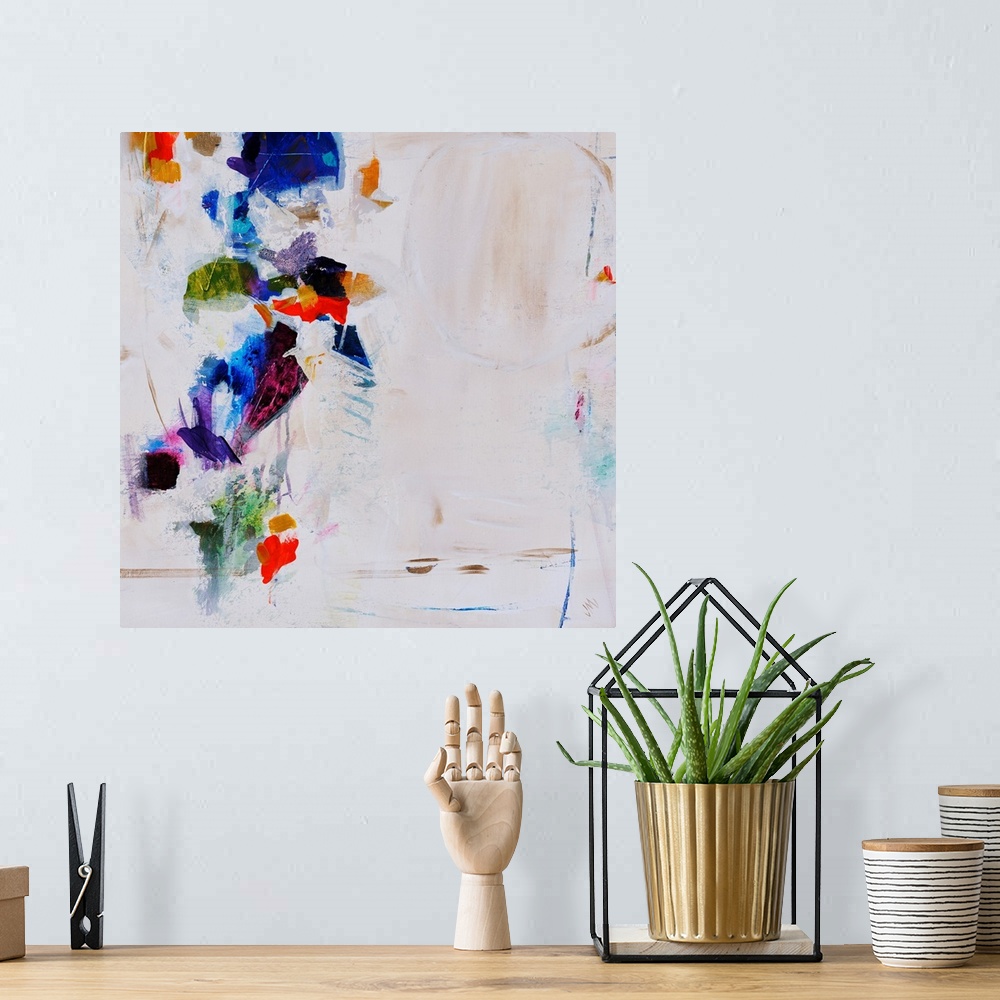 A bohemian room featuring Abstract painting featuring vibrant splotches of color over a neutral background.