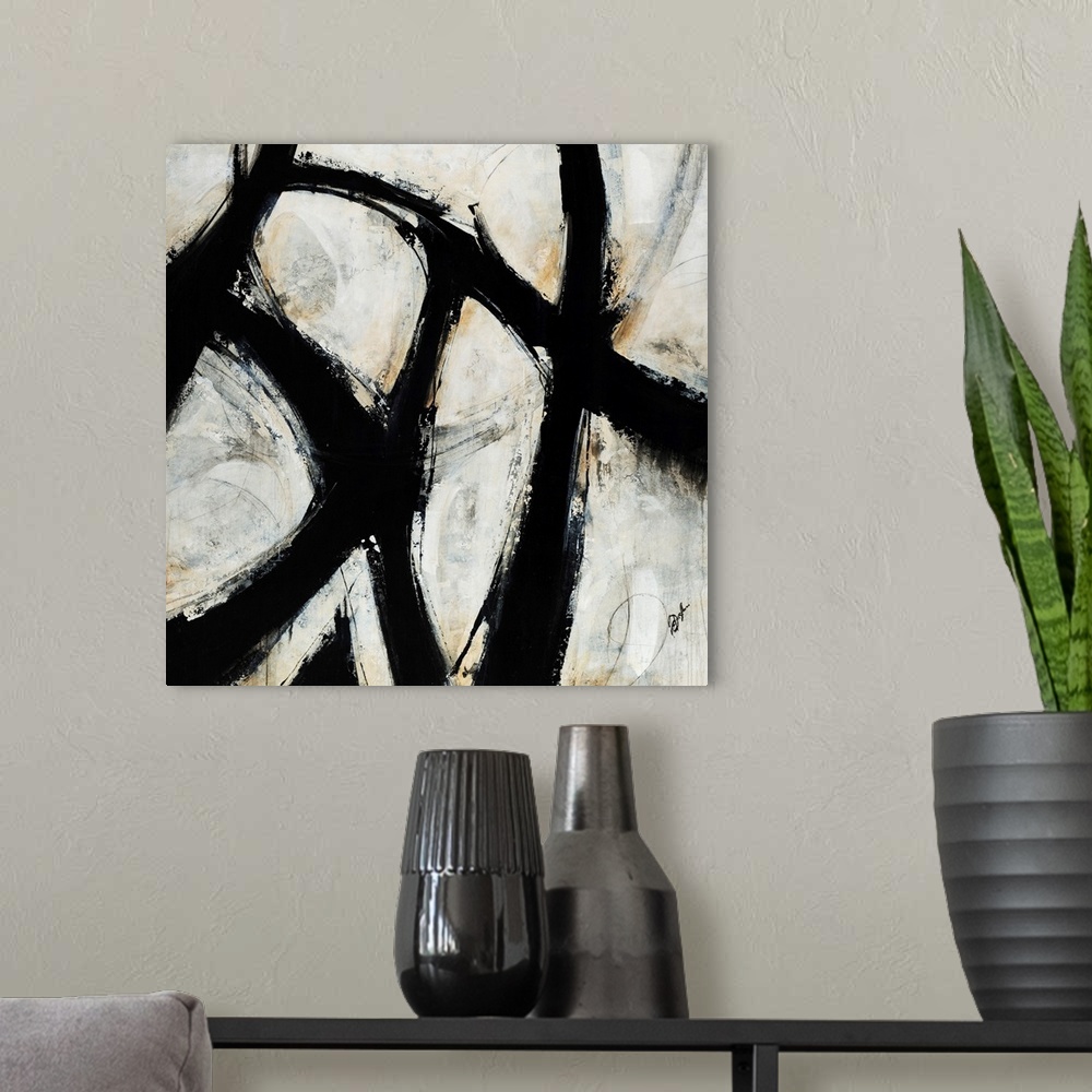 A modern room featuring Contemporary abstract painting of black brush strokes over a netural background.