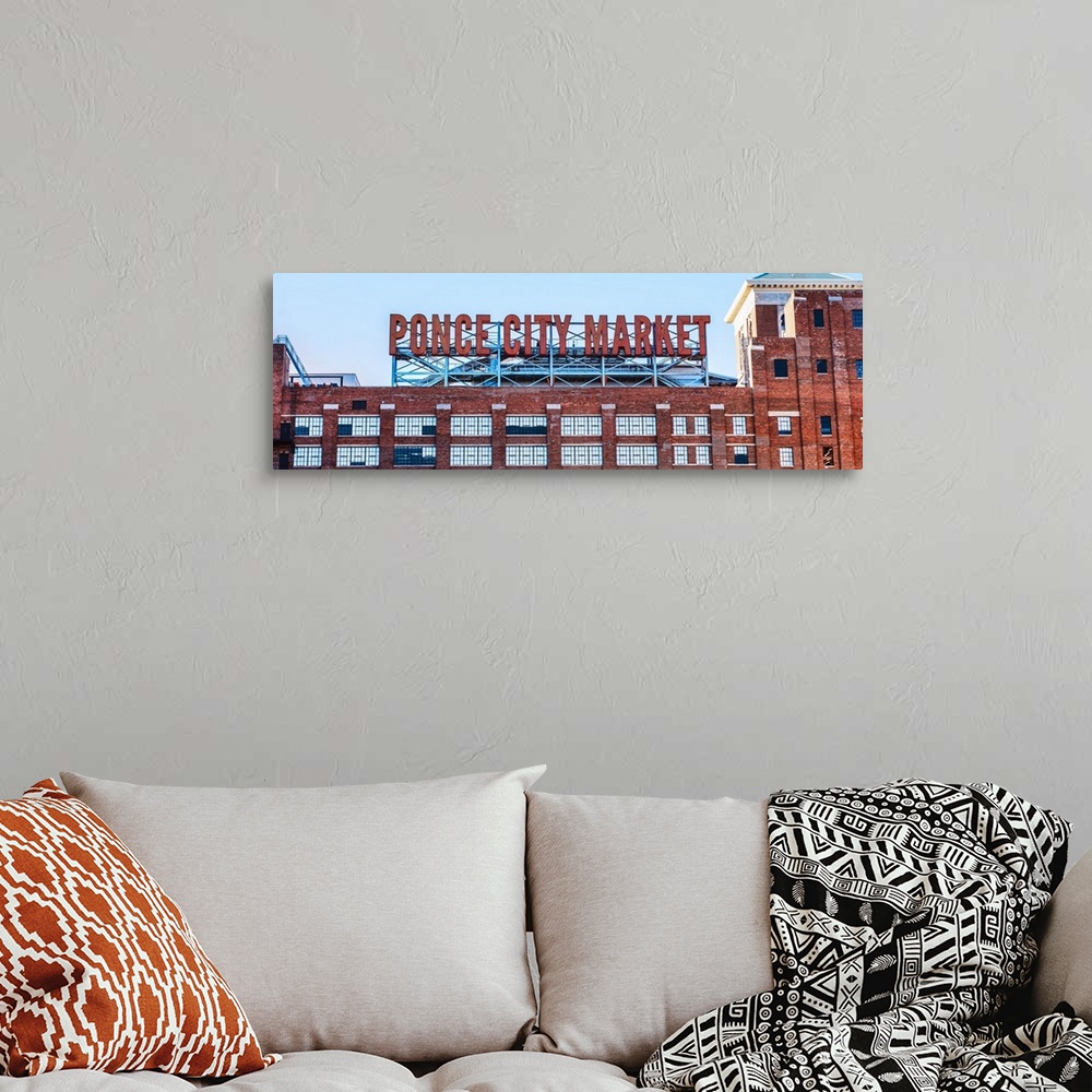 A bohemian room featuring Tall neon letters on the rooftop terrace of Ponce City Market, a historic Sears, Roebuck and Co. ...