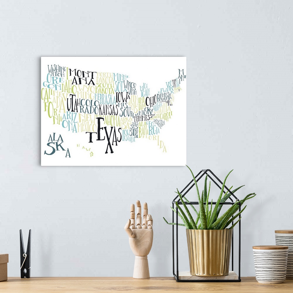A bohemian room featuring A hand-drawn typography map of the United States with all the state names, in yellow, green, and ...