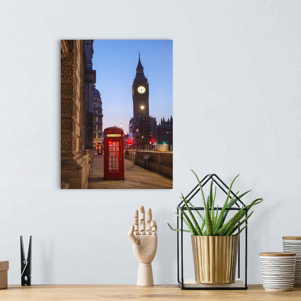 A bohemian room featuring Photograph of a red telephone booth lit up at night with Big Ben in the background.