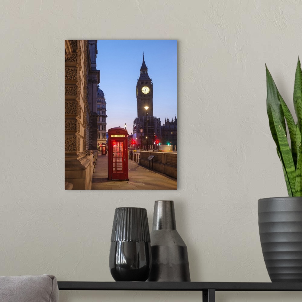 A modern room featuring Photograph of a red telephone booth lit up at night with Big Ben in the background.