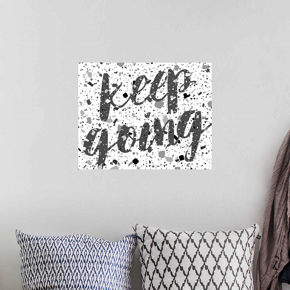 A bohemian room featuring Words of encouragement in a monochrome grey color scheme.