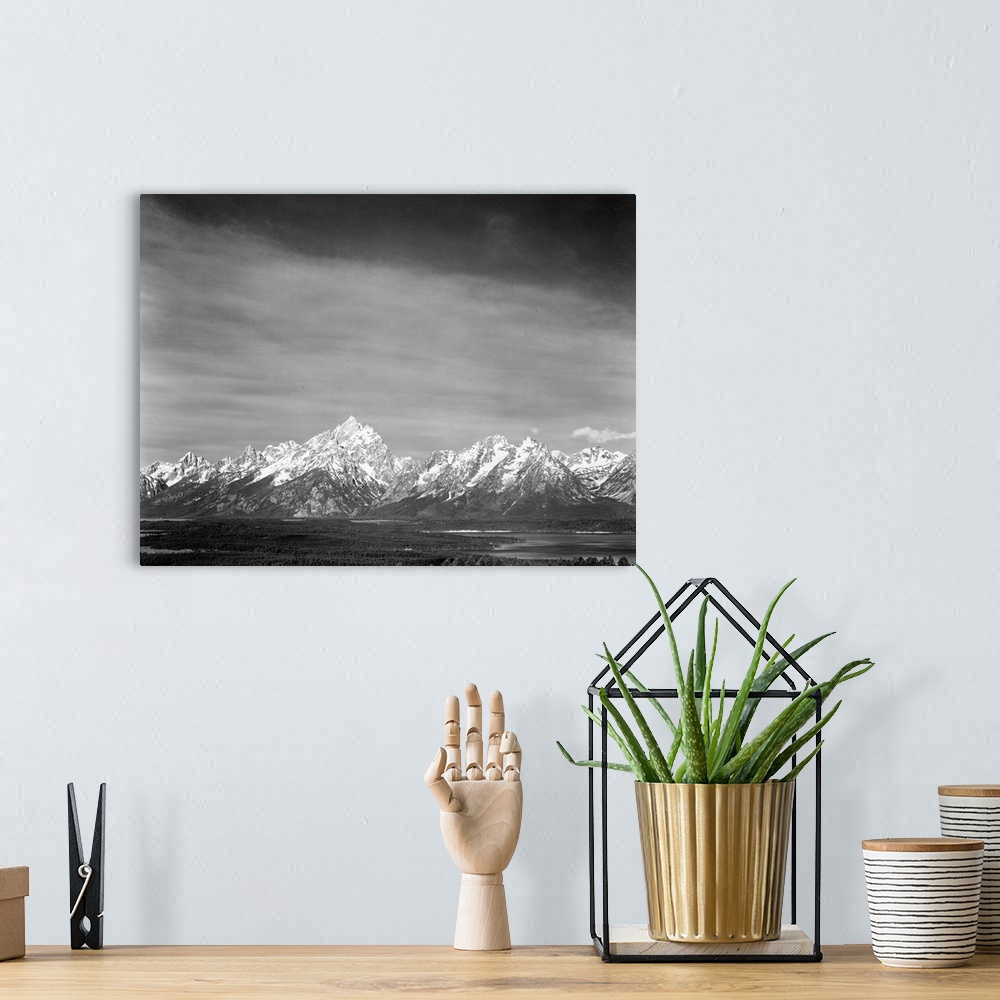 A bohemian room featuring Tetons from Signal Mountain, valley, snow-capped mountains, low horizons.