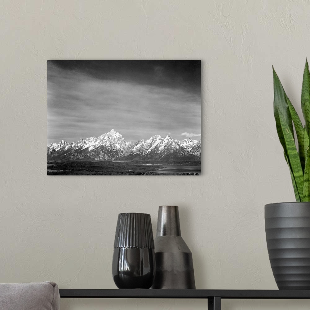 A modern room featuring Tetons from Signal Mountain, valley, snow-capped mountains, low horizons.