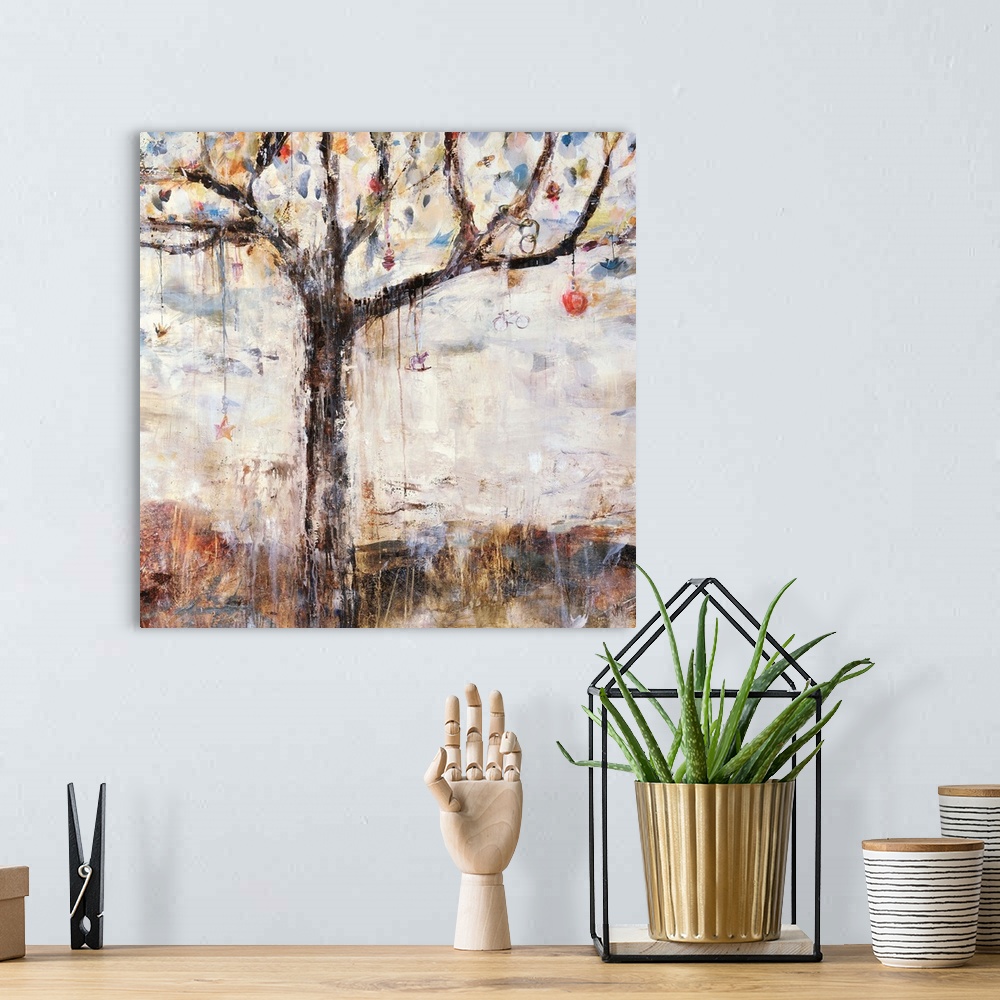 A bohemian room featuring Abstracted painting of a tree with various  charms and bobbles hanging from its branches.