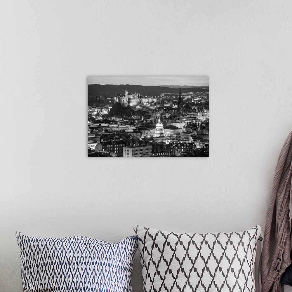A bohemian room featuring Black and white aerial photograph of the city of Edinburgh with the Edinburgh Castle standing out.