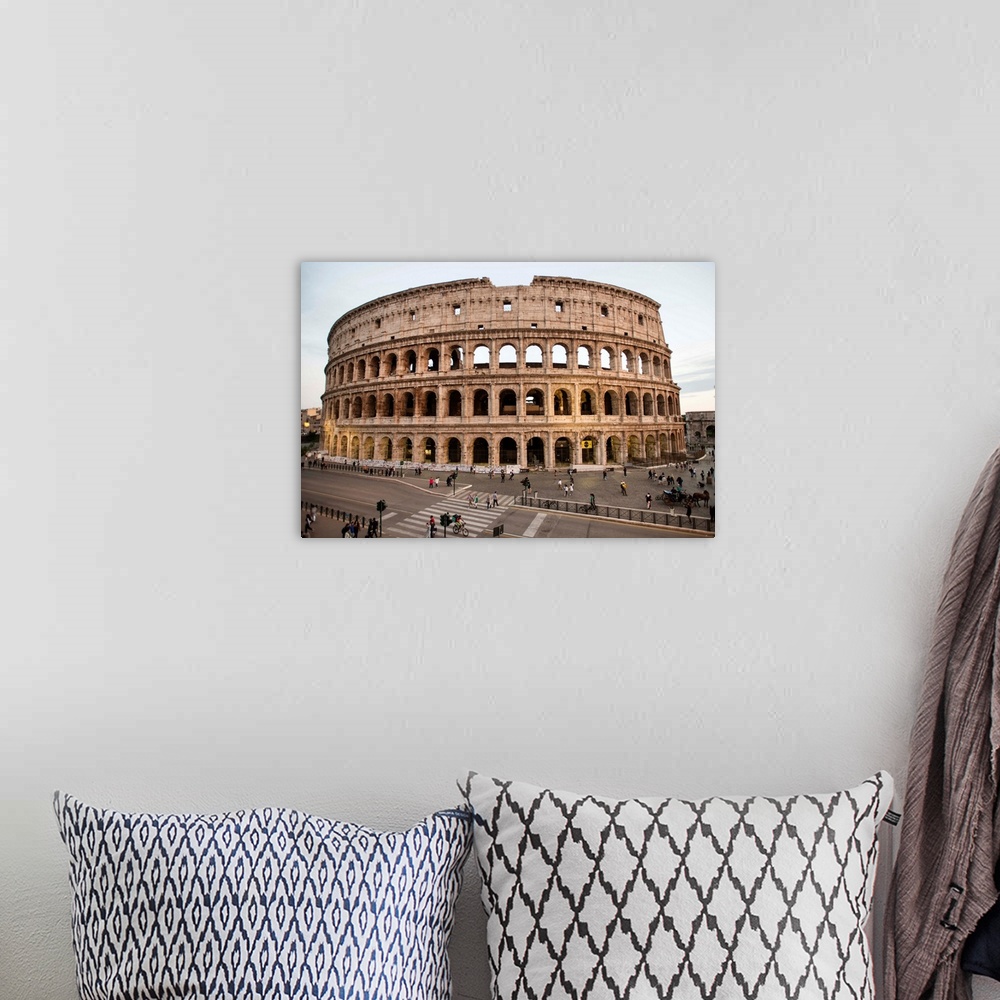 A bohemian room featuring Photograph of the Colosseum from across the street with tourists surrounding the grounds.
