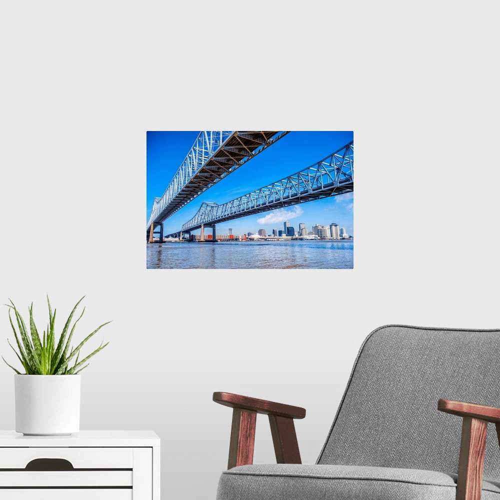 A modern room featuring Photograph of the Crescent City Connection, formerly the Greater New Orleans Bridge, twin cantile...