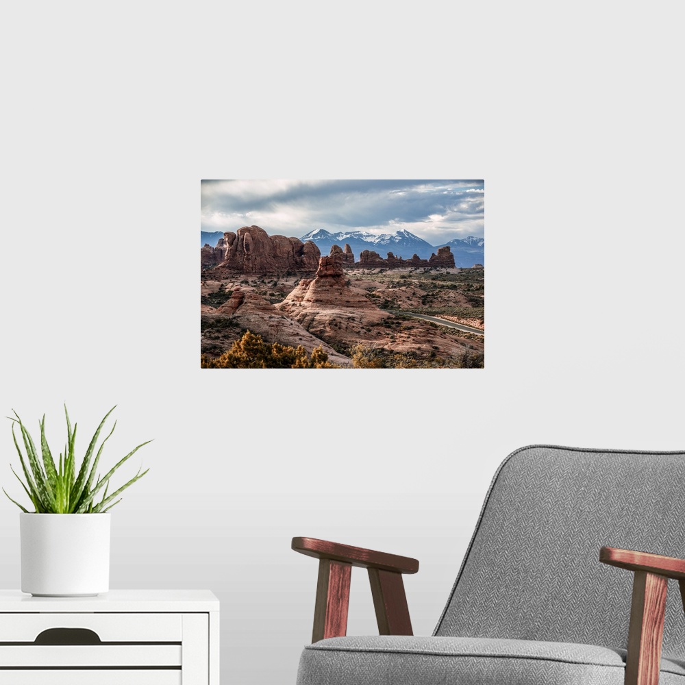A modern room featuring Fiery Furnace sandstone rock formations with the La Sal Mountains in the distance, Arches Nationa...
