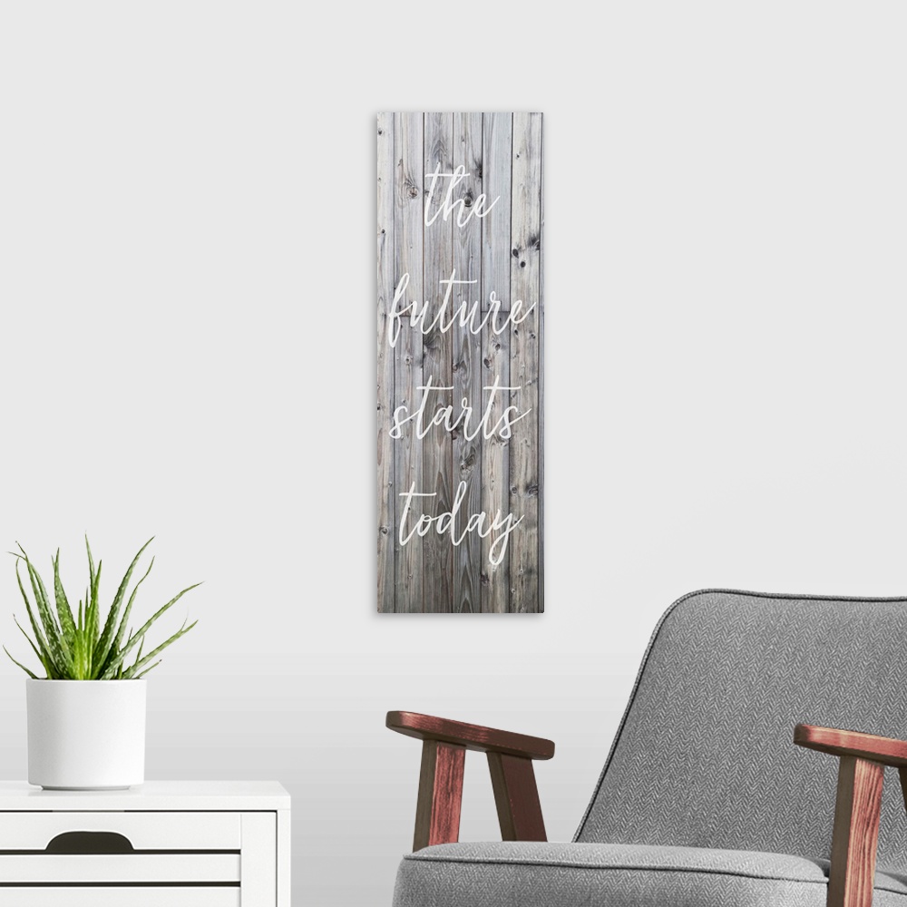 A modern room featuring Motivational sentiment written on a banner, over grey wooden planks.