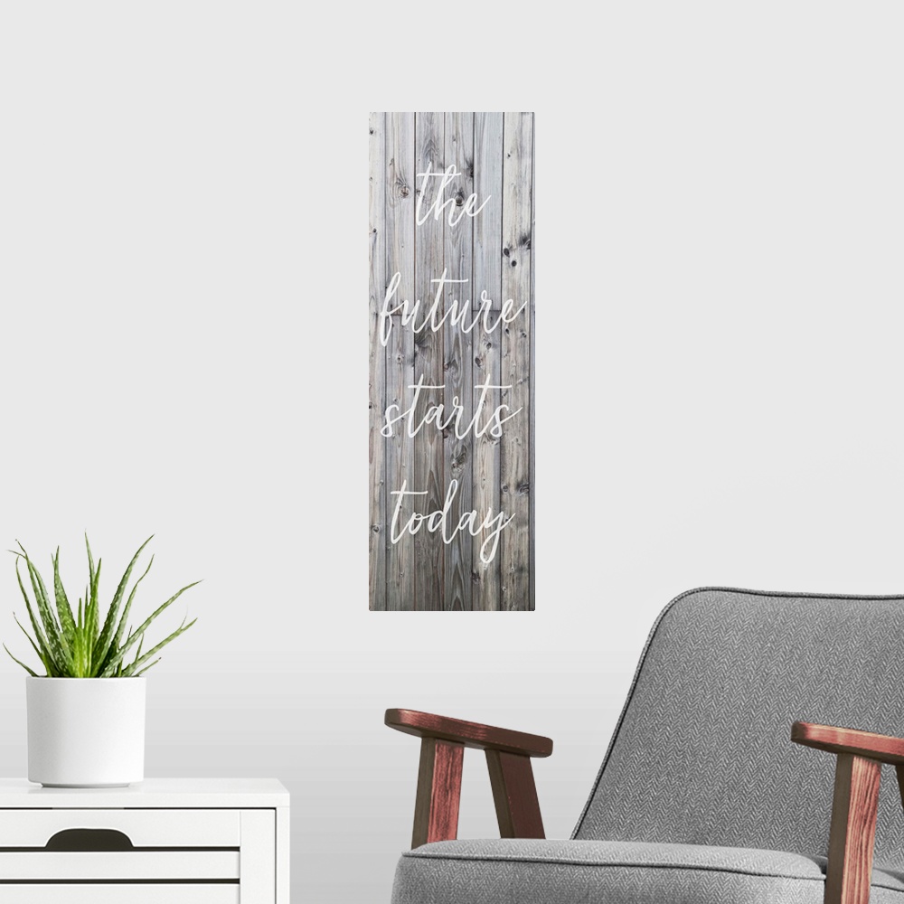 A modern room featuring Motivational sentiment written on a banner, over grey wooden planks.