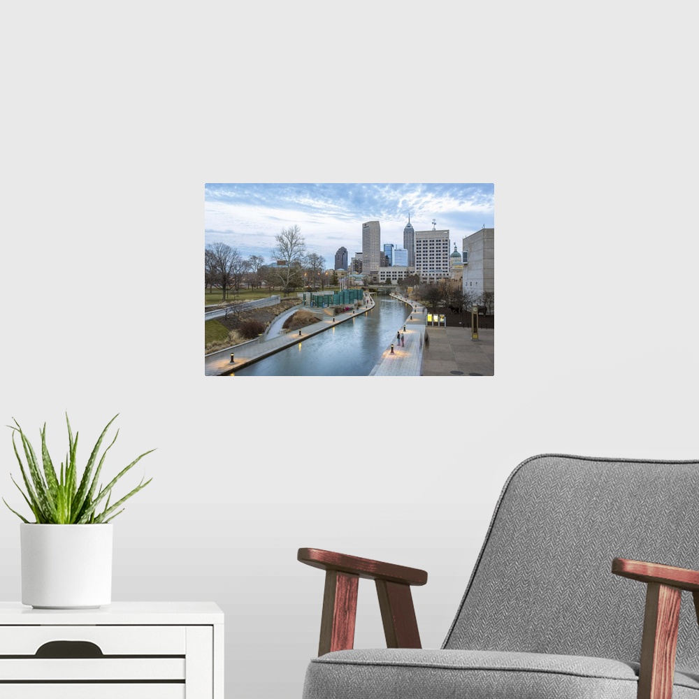 A modern room featuring Waterway through the city of Indianapolis, Indiana, just before sunset.