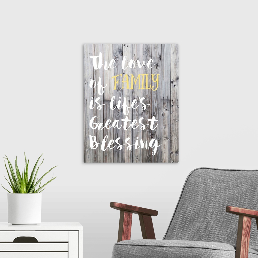 A modern room featuring "The love of family is life's greatest blessing" in hand-lettered text over a background of woode...