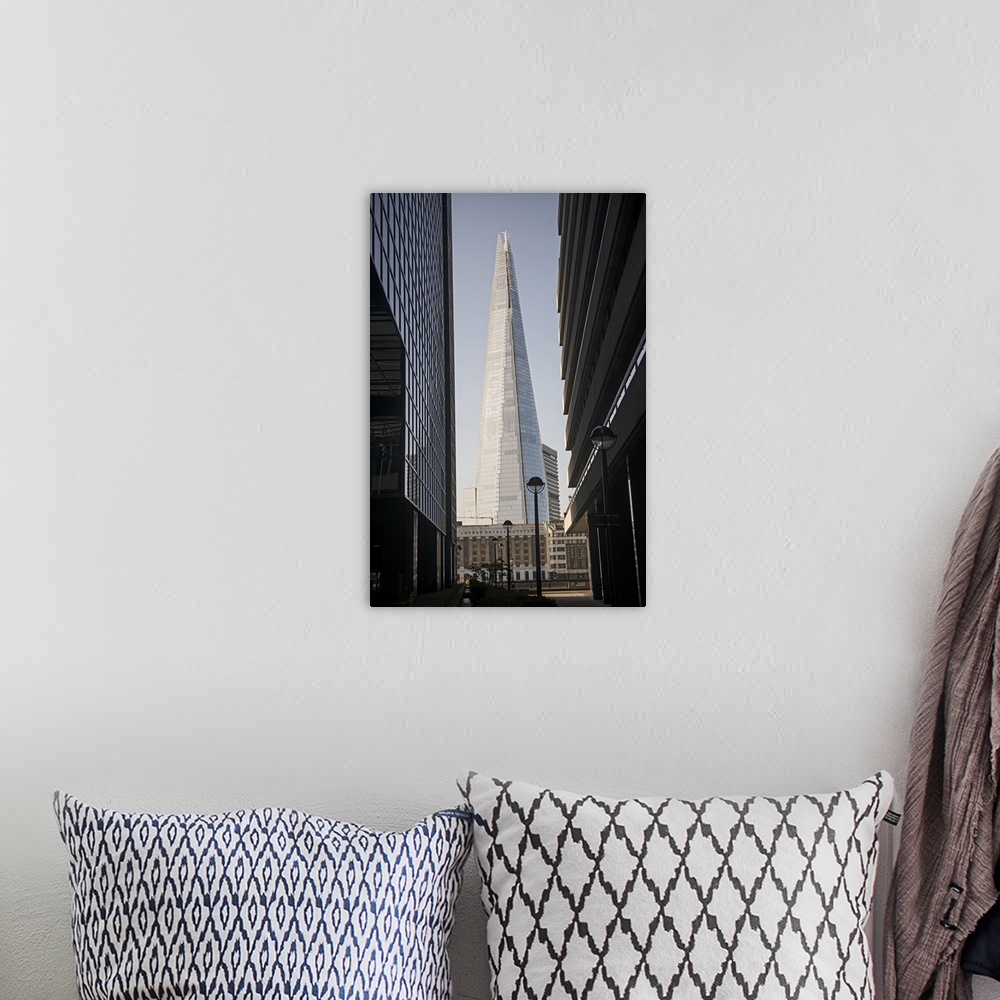 A bohemian room featuring Photograph of The Shard building in Southwark, London, seen through two other buildings.