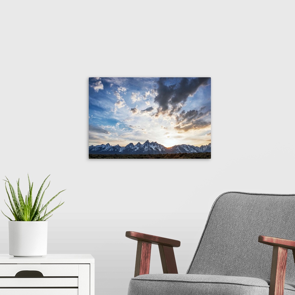A modern room featuring View of clouds over Teton mountains in the morning in Wyoming.