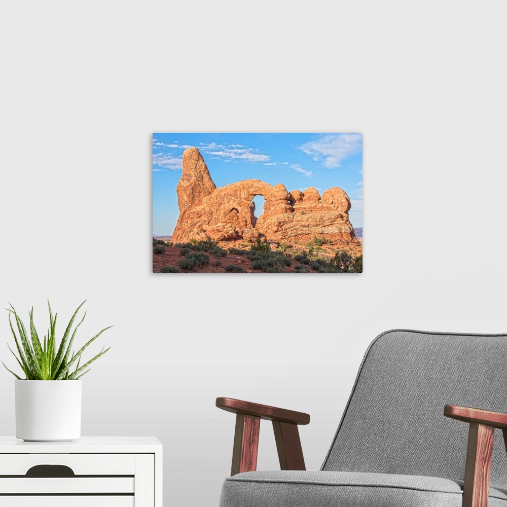A modern room featuring The Turret Arch under a blue sky in Arches National Park, Utah.