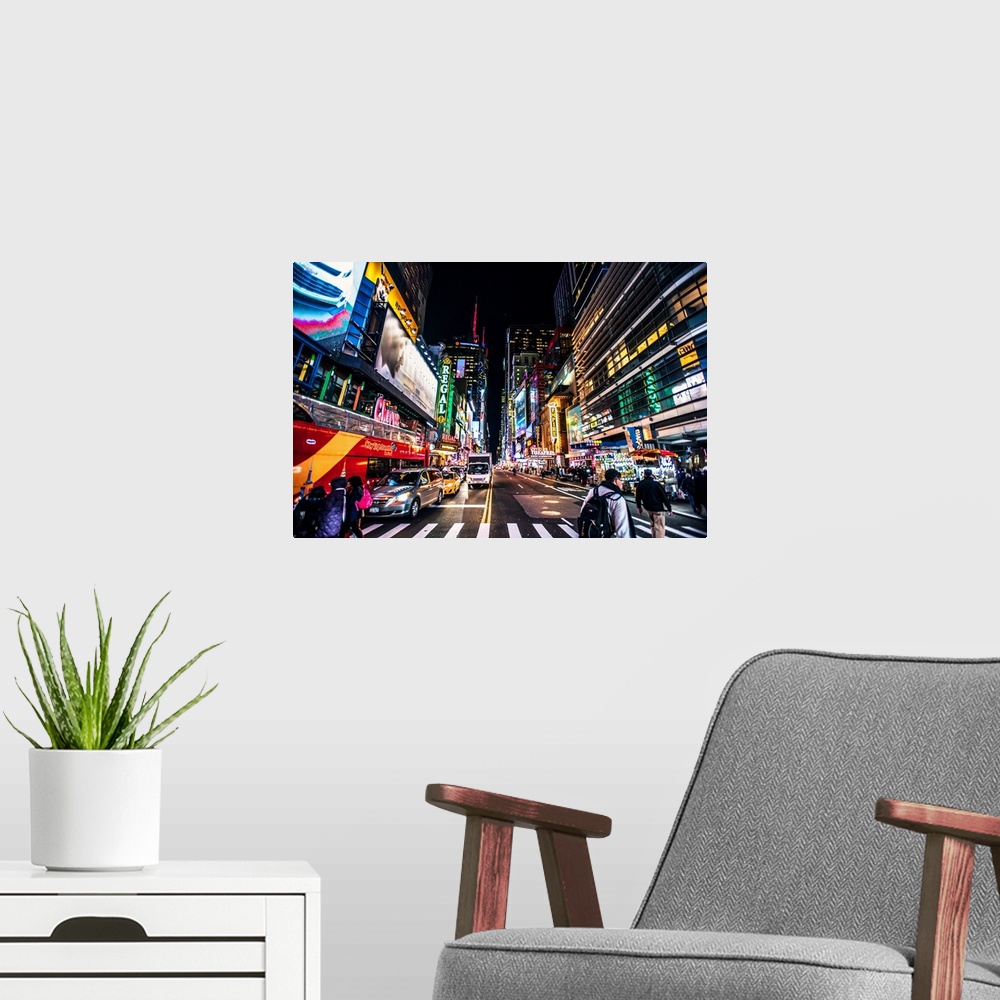 A modern room featuring View of advertising signs on 42nd street in New York city at night.