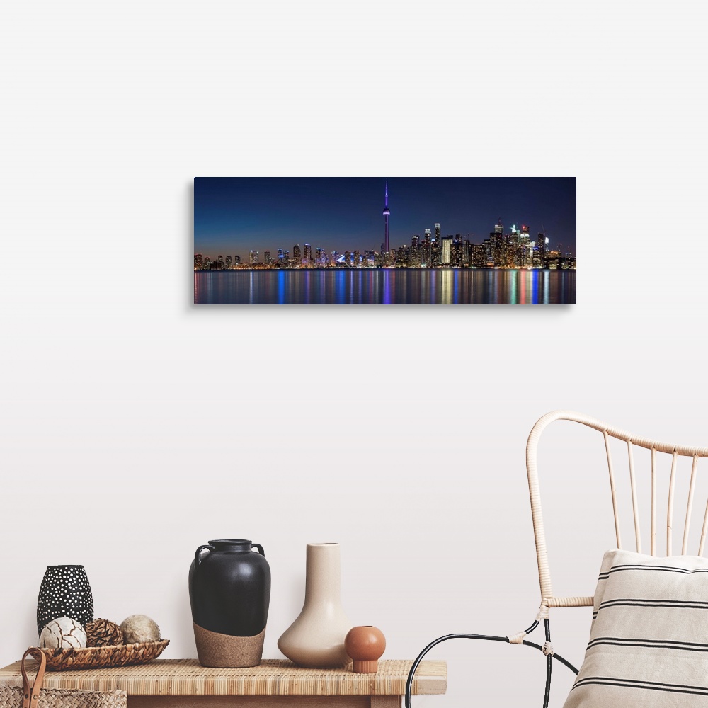 A farmhouse room featuring Panoramic photo of the Toronto city skyline with lights reflected in the water at night.