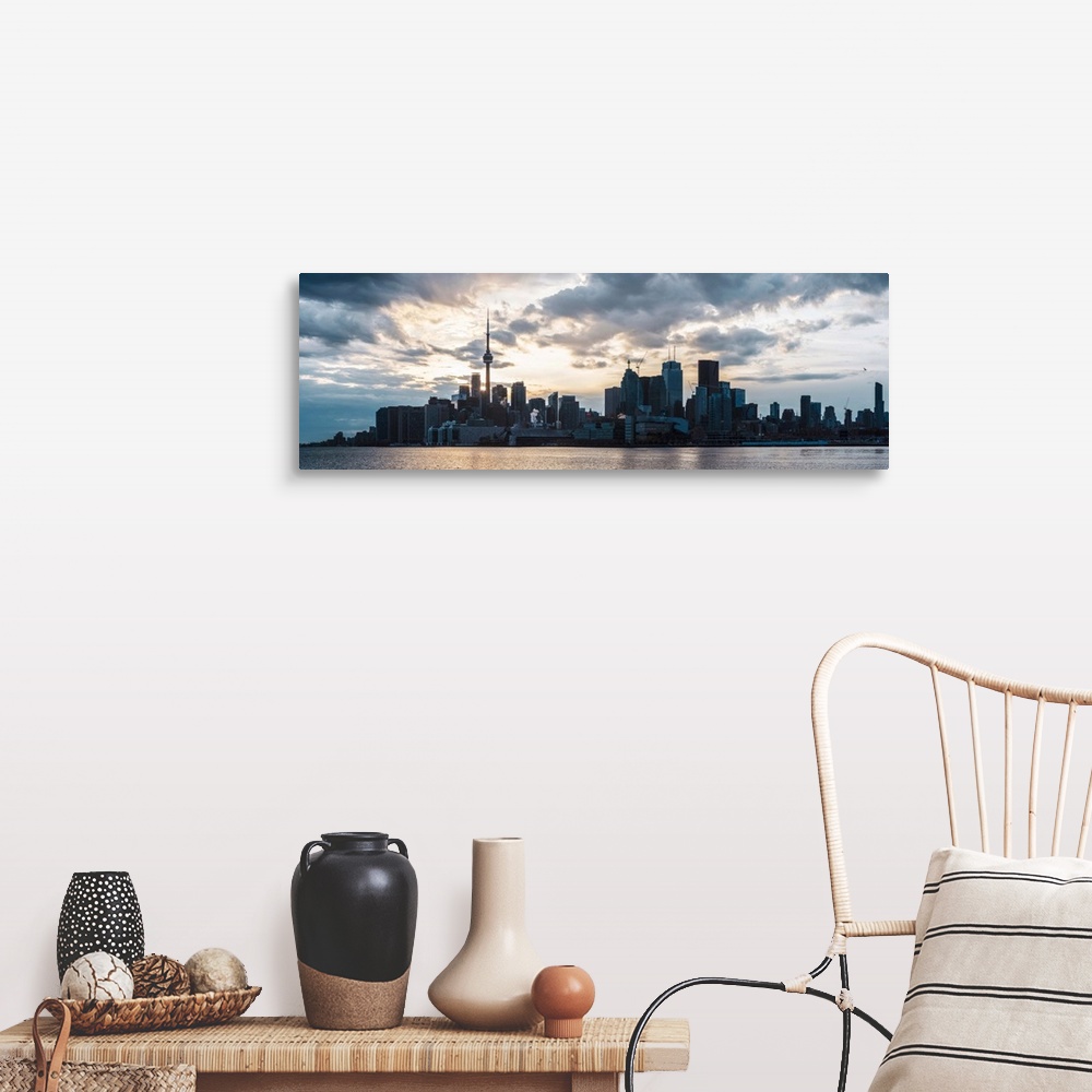 A farmhouse room featuring Toronto city skyline under a dramatic sunset with clouds overhead, Ontario, Canada.