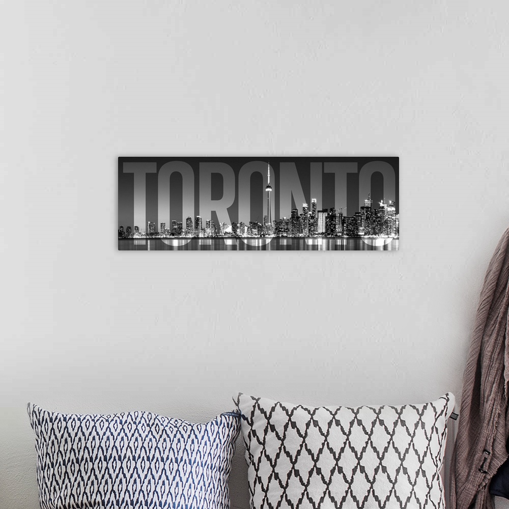 A bohemian room featuring Transparent typography art overlay against a photograph of the Toronto city skyline.