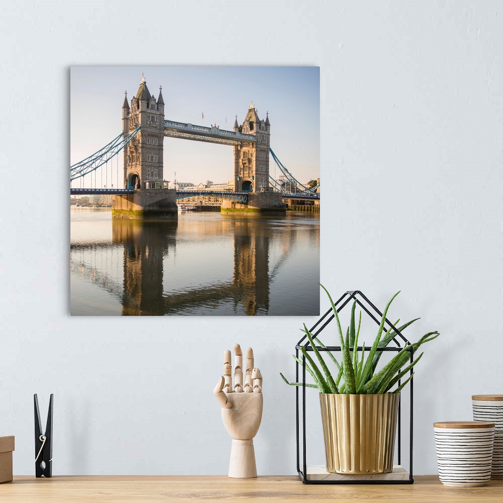 A bohemian room featuring Square photograph of Tower Bridge reflecting into the River Thames in London, England, UK.