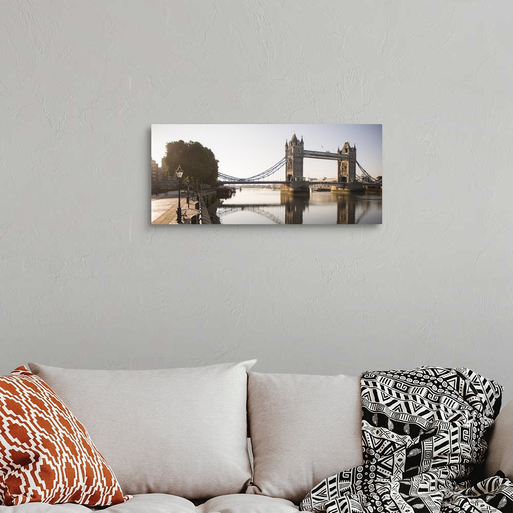 A bohemian room featuring Panoramic photograph of Tower Bridge  reflecting on River Thames with a brick sidewalk on the side.