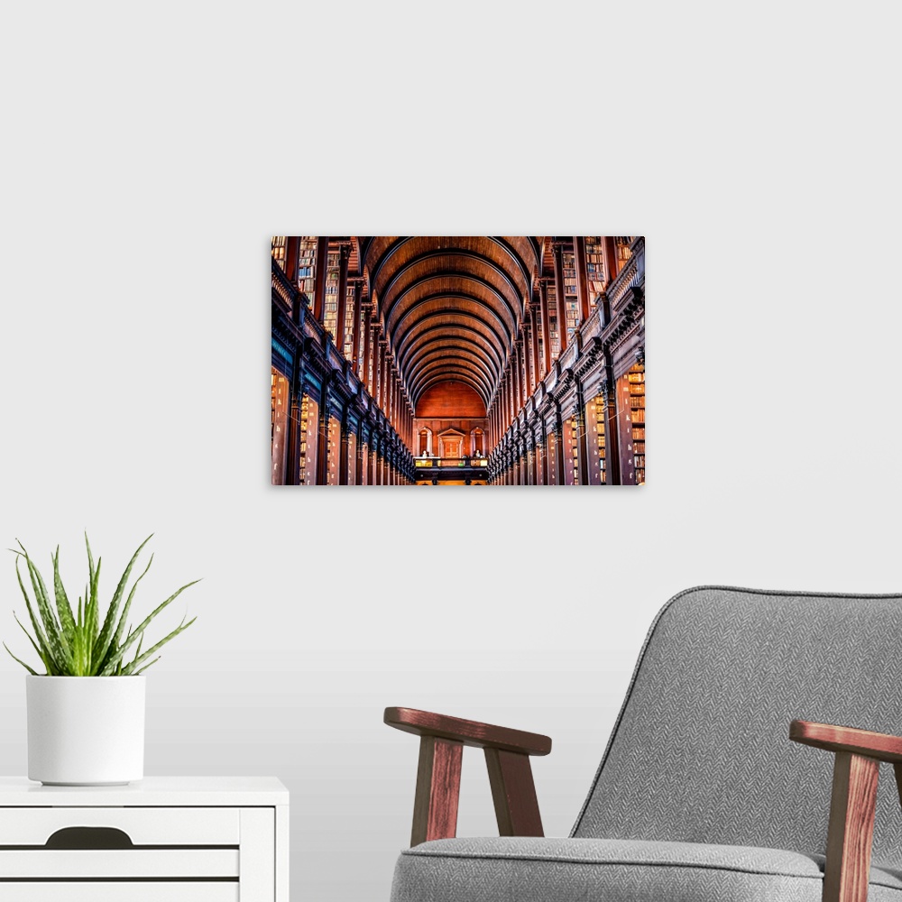A modern room featuring Photograph of the arched wooden ceilings of Trinity College Library, which serves Trinity College...