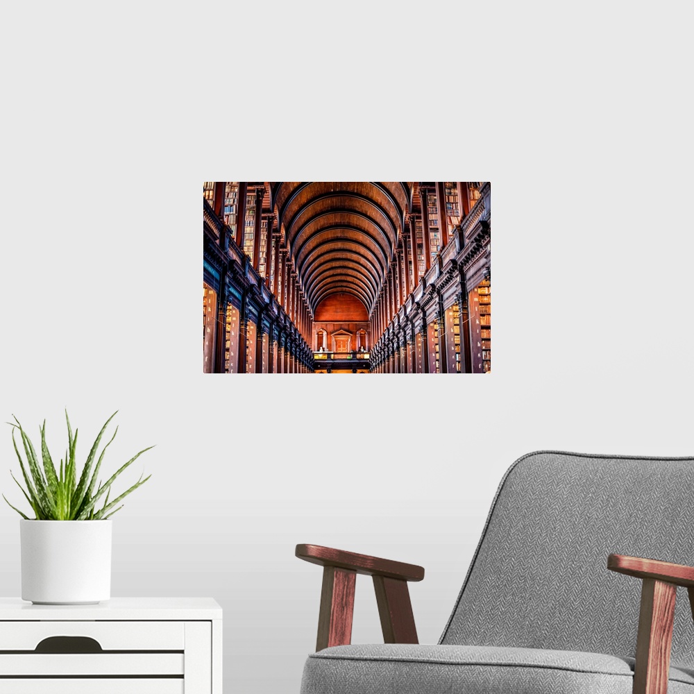 A modern room featuring Photograph of the arched wooden ceilings of Trinity College Library, which serves Trinity College...