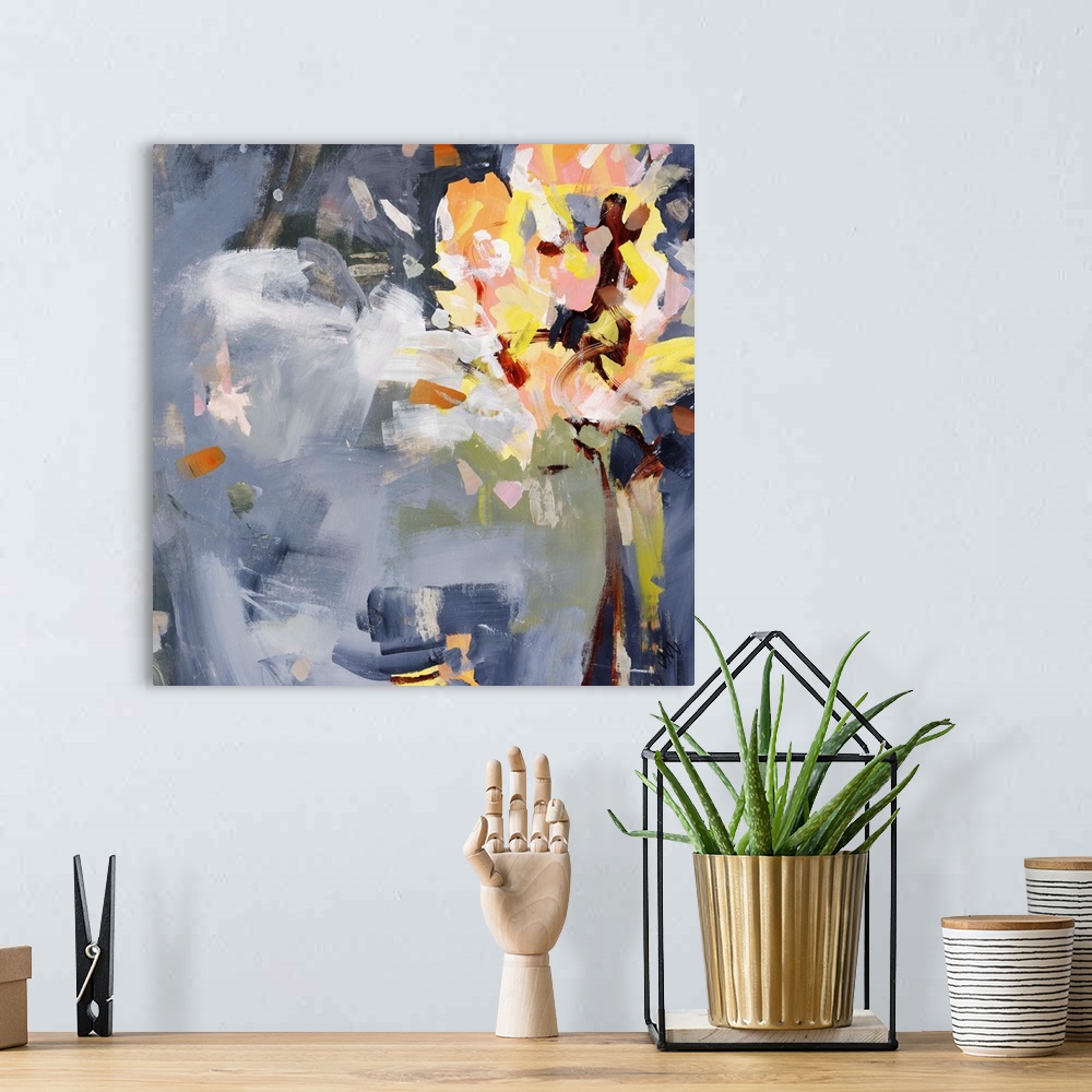 A bohemian room featuring Square abstract painting of florals over an indigo background.