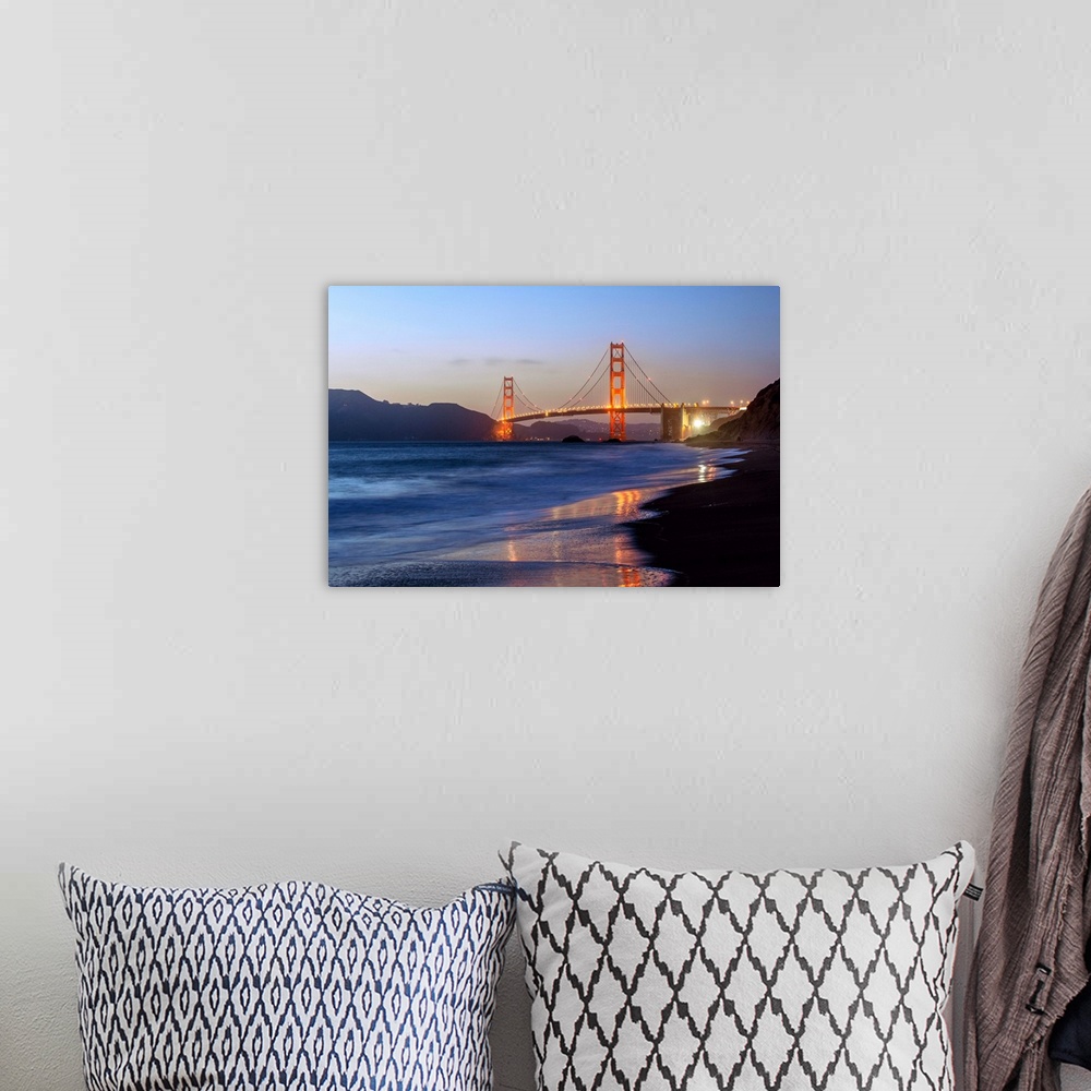 A bohemian room featuring Twilight photograph of the Golden Gate Bridge taken from the shore.