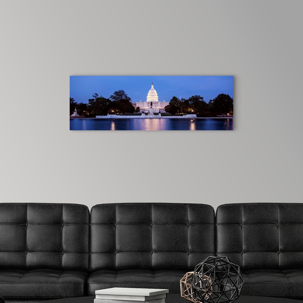 A modern room featuring Panoramic photograph of the U.S. Capitol Building at dusk with blue and magenta hues from the Cap...