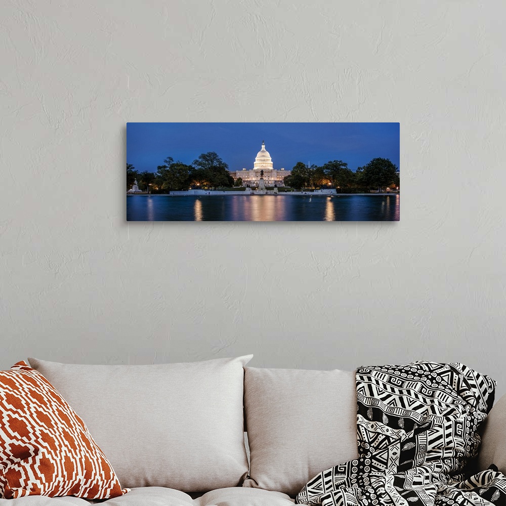 A bohemian room featuring Panoramic photograph of the U.S. Capitol Building at dusk from the Capitol Reflecting Pool.