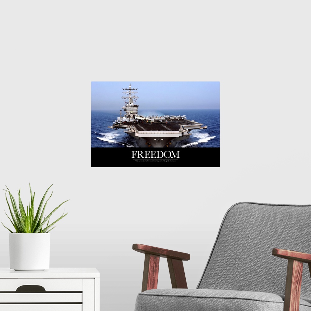 A modern room featuring An immense photograph taken of a US navy ship in the open ocean with the word "Freedom" just belo...