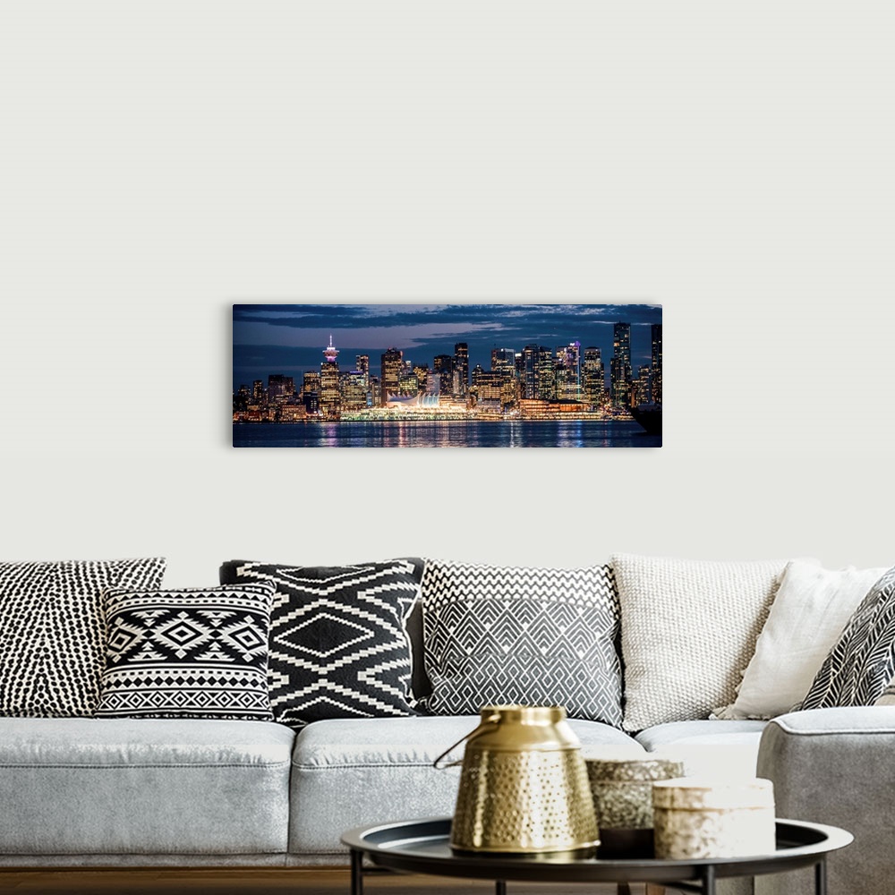 A bohemian room featuring Panoramic photograph of the Vancouver, British Columbia skyline lit up on a dark blue night and r...
