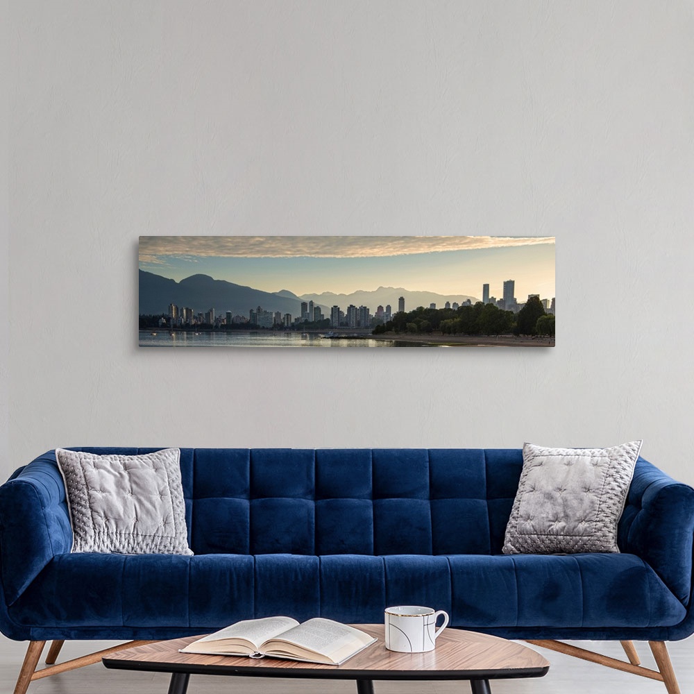 A modern room featuring Panoramic photograph of the Vancouver, British Columbia, Canada skyline at sunset with silhouette...